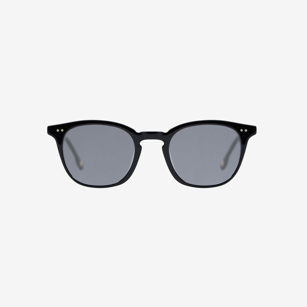 A pair of classic squared sunglasses with black frames and gray lenses sits centered on a white background.