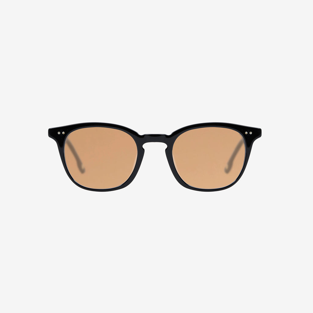 A pair of squared, black-framed sunglasses features light brown lenses.